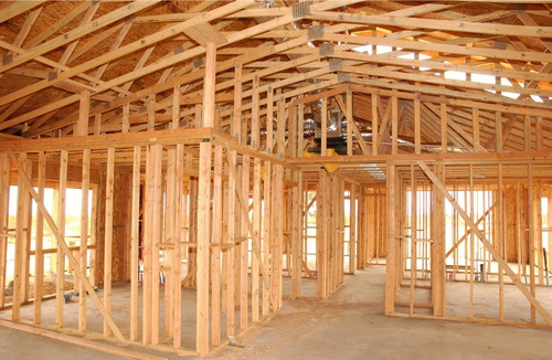 new house being built showing the framing of the house